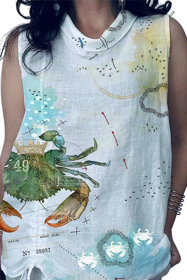 Close-up of a sleeveless white blouse featuring colorful graphic designs of a crab, scientific markings, and decorative elements.