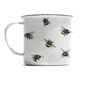A white mug decorated with a pattern of several bees.
