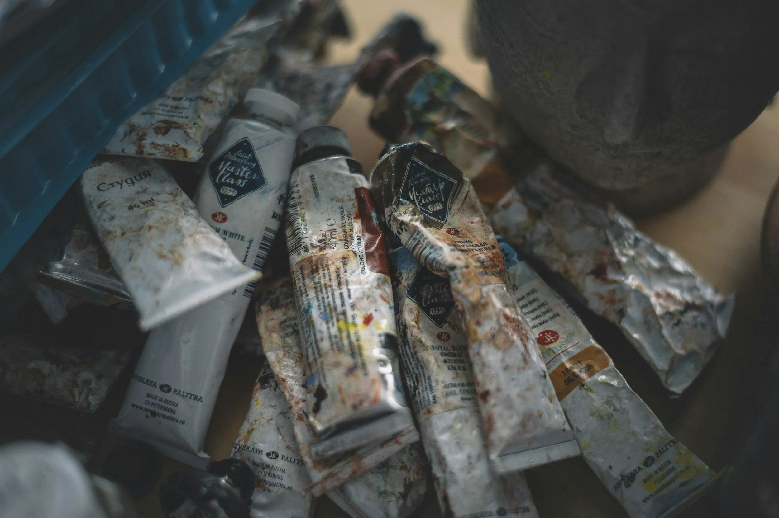 sketchbook reveals with art materials, paints, brushes and flowers