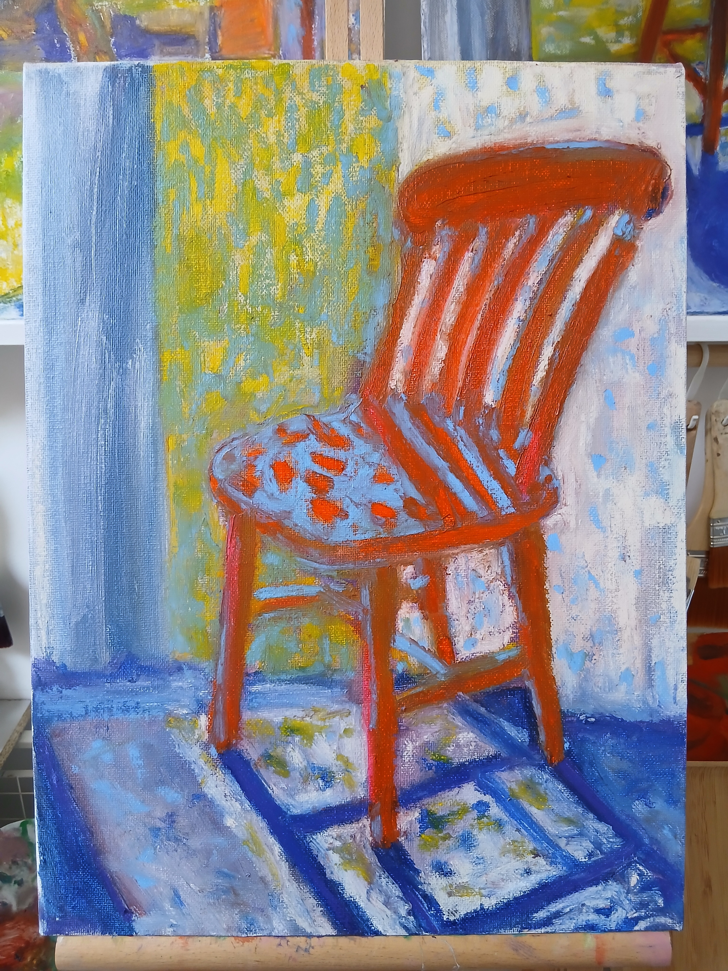 farmhouse cottage chair oil painting in the studio.png