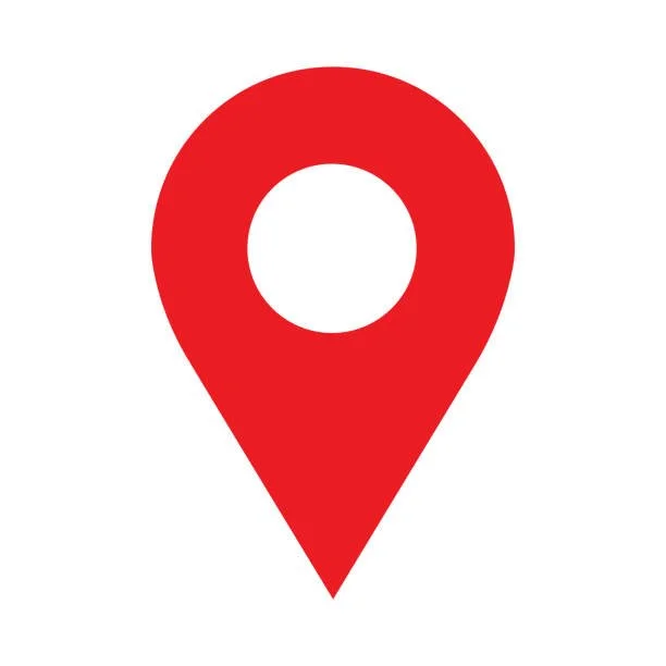 Red location pin icon with a white circle in the center