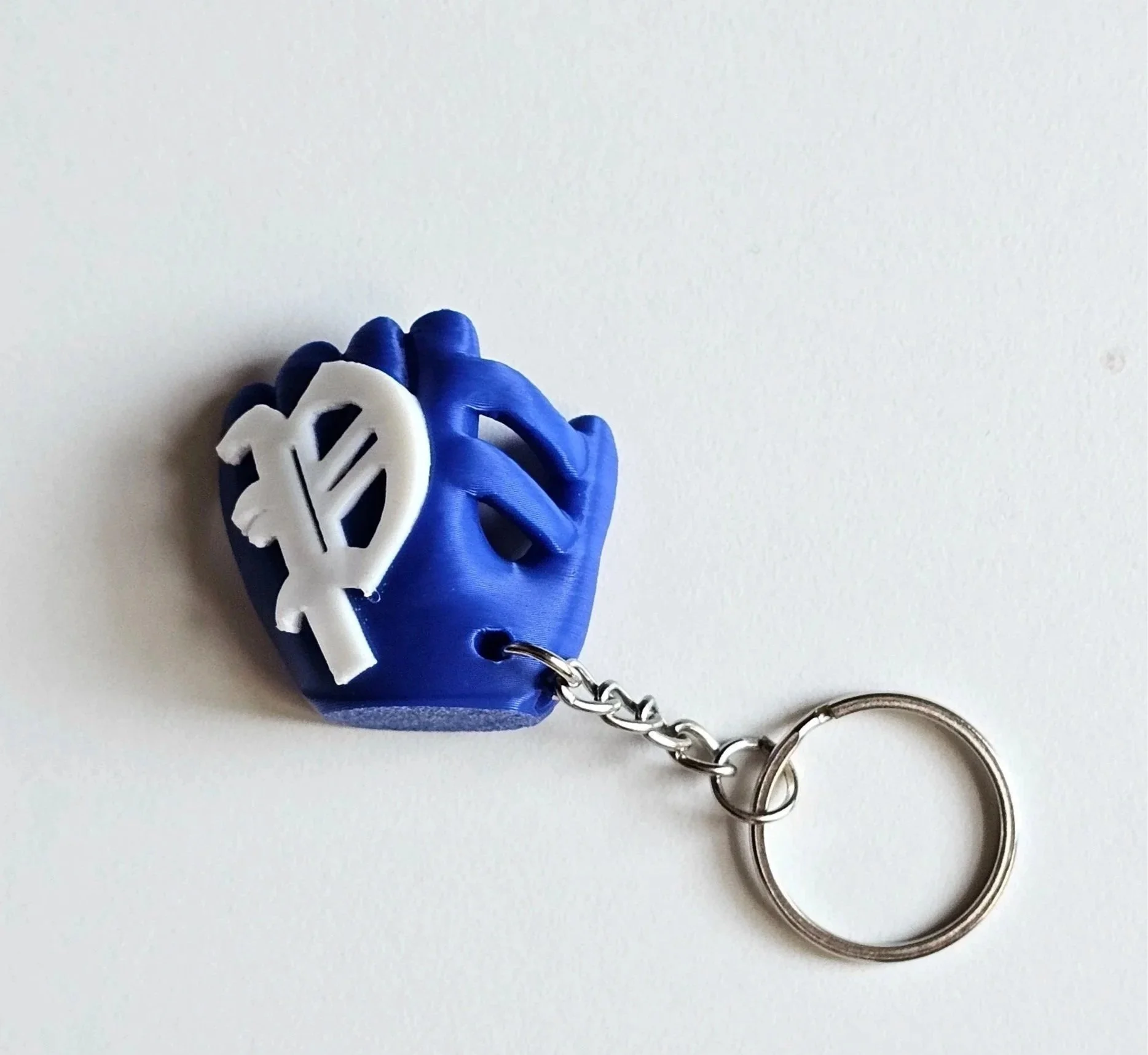 Portachiavi a forma di mano blu con un simbolo del dollaro bianco