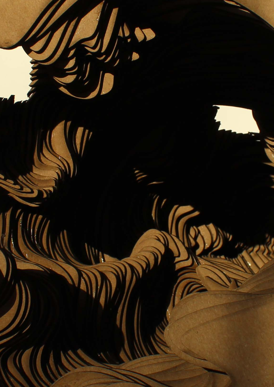 Close-up image of layered, wavy, black and tan paper strips creating an abstract, flowing pattern.