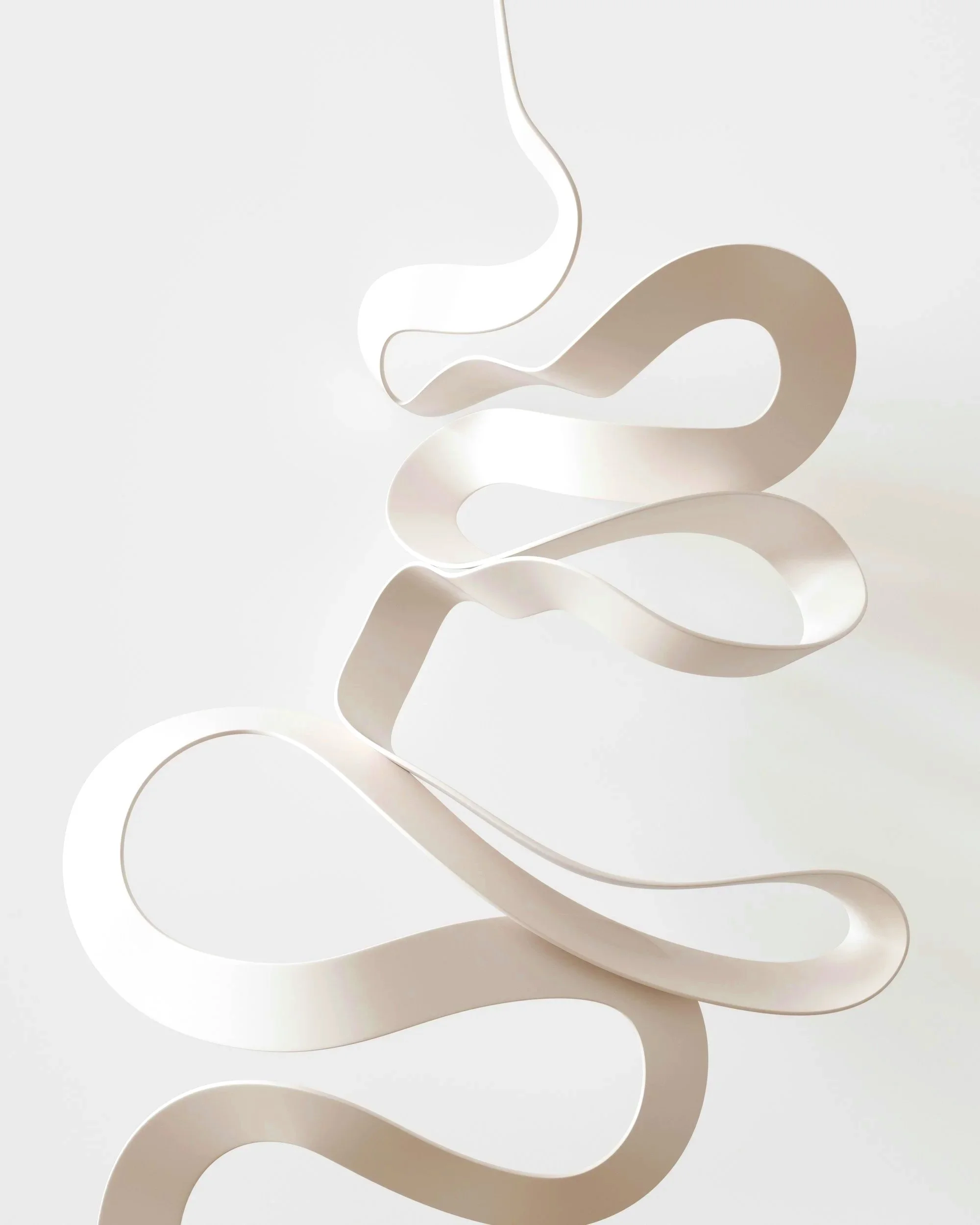 Abstract white and beige curving sculptural art piece with flowing lines set against a plain background.