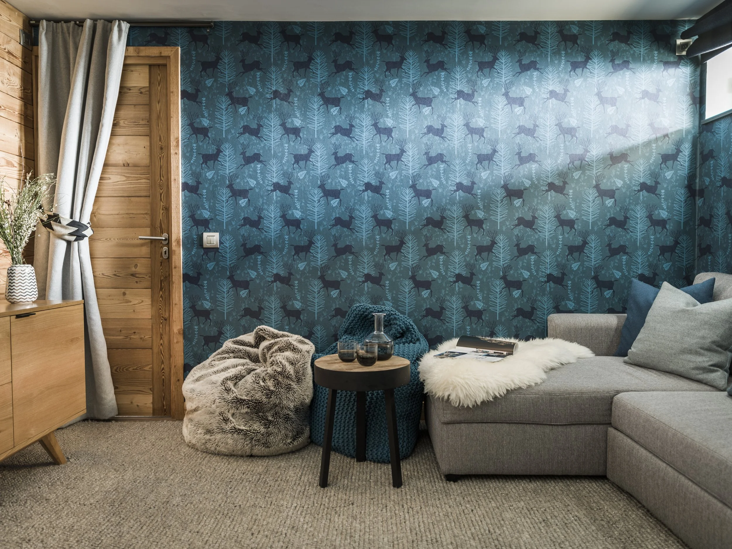 Mind the Gap stag wallpaper adding chalet style to this cinema room