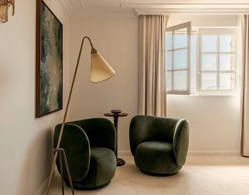 Made to measure linen curtains provide a subtle layer to a luxury corner