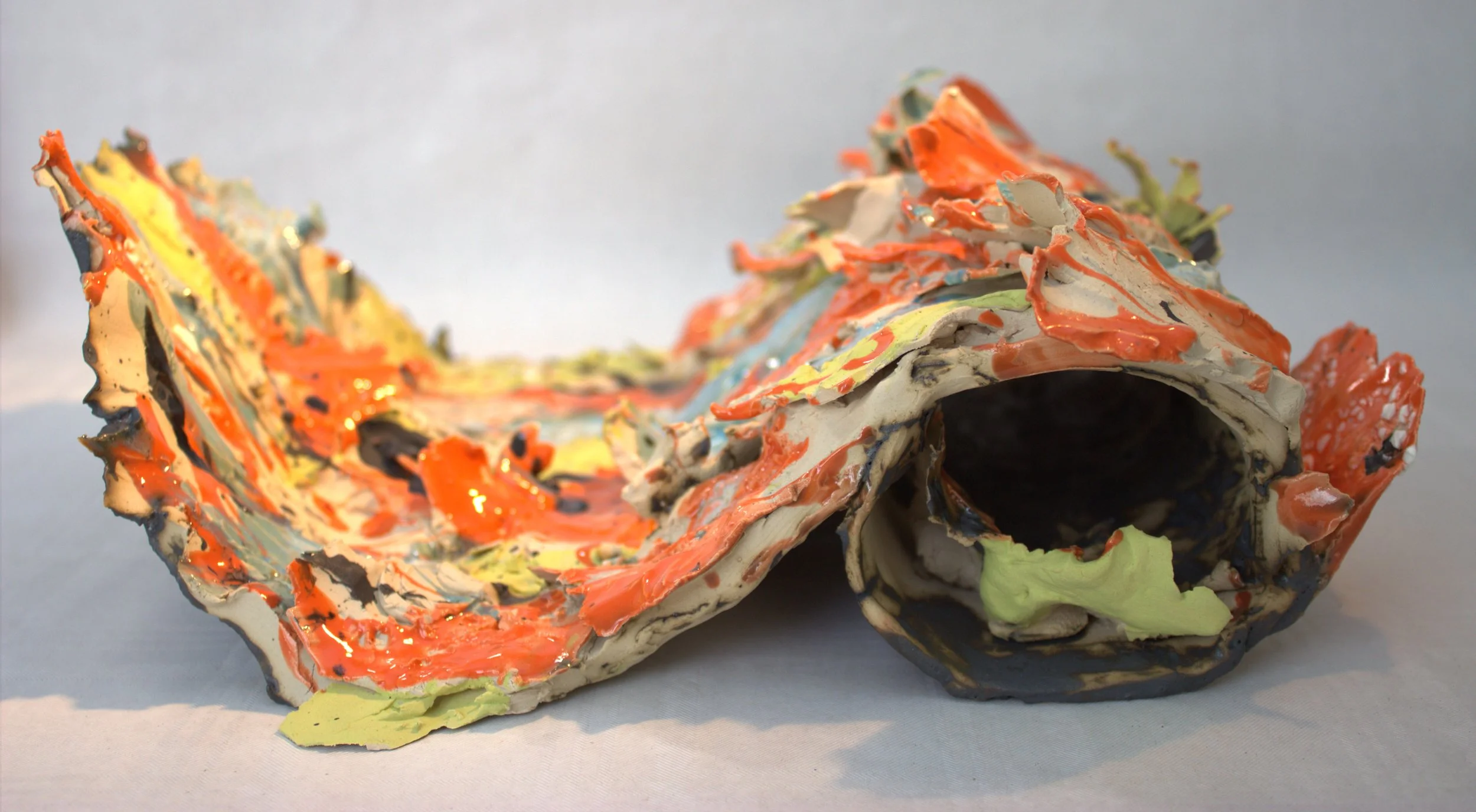 Colorful abstract ceramic sculpture depicting creativity breaking free