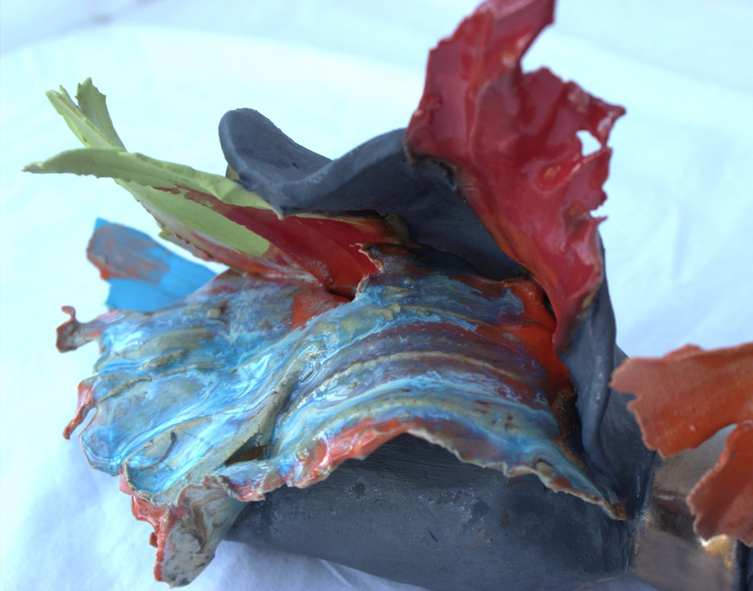 Close-up of a colorful, textured ceramic sculpture .