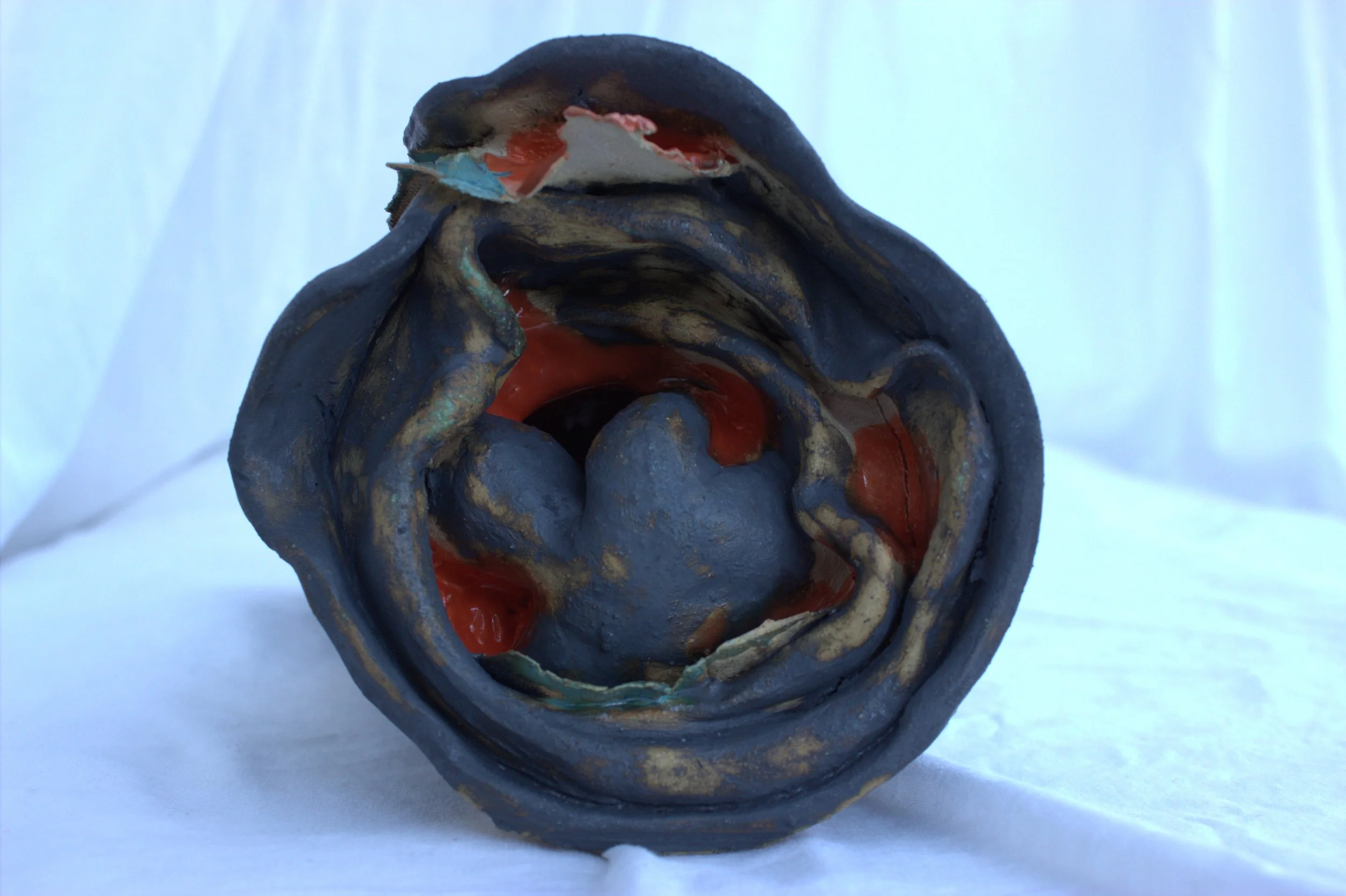 Closeup of a hidden ceramic figure .