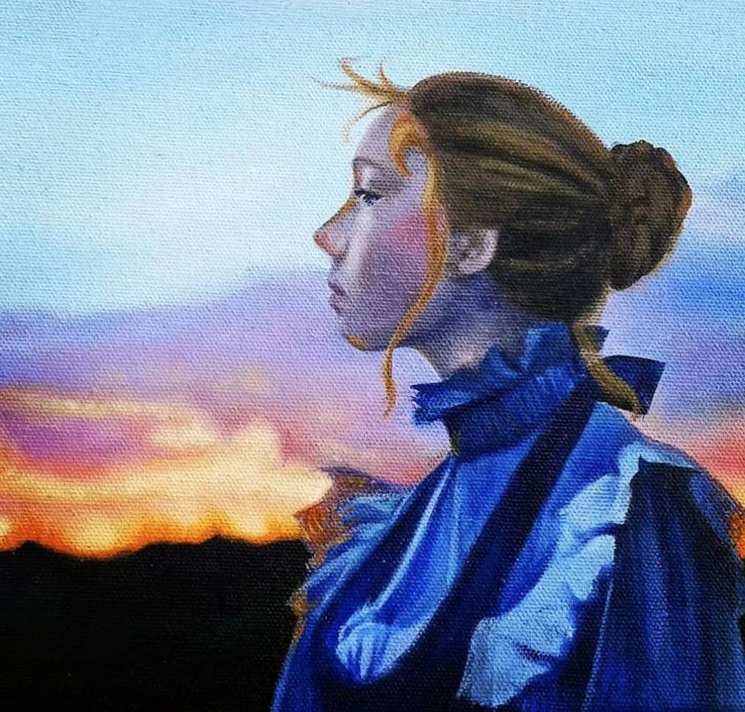 A painting of a young woman with blonde hair tied in a bun, facing left, wearing a blue dress, against a sunset sky with pink, purple, and orange clouds.