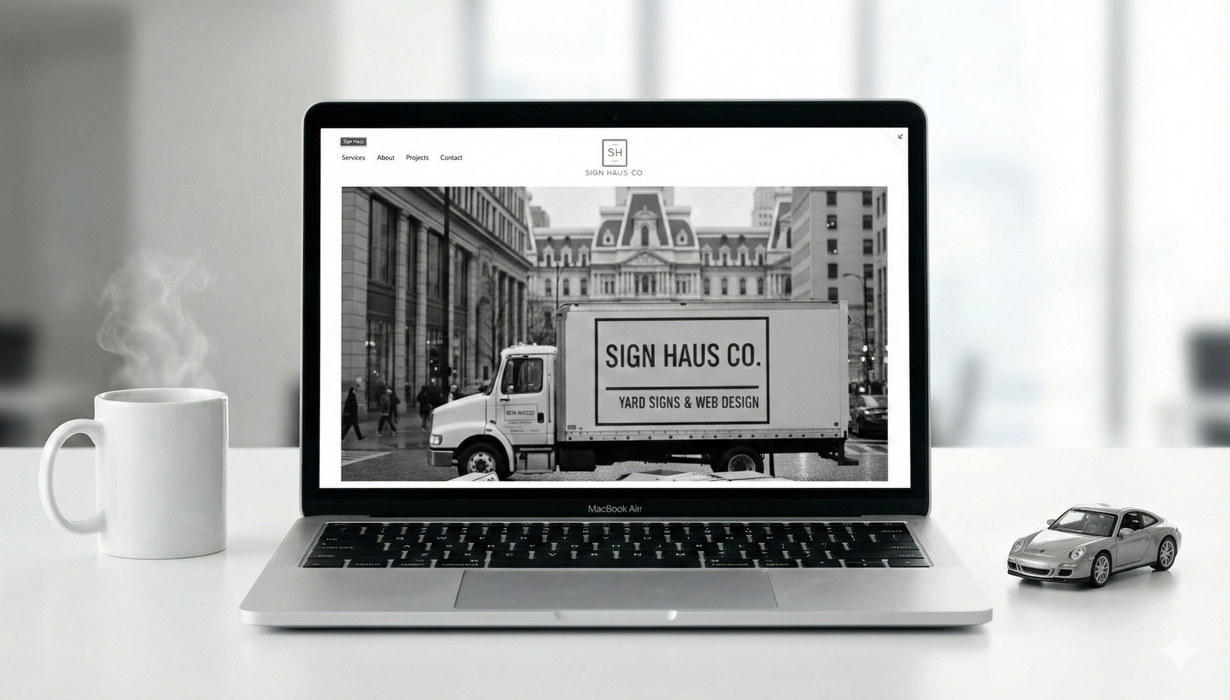 Custom yard sign for local business with premium wire stake standing in grass in New Jersey.