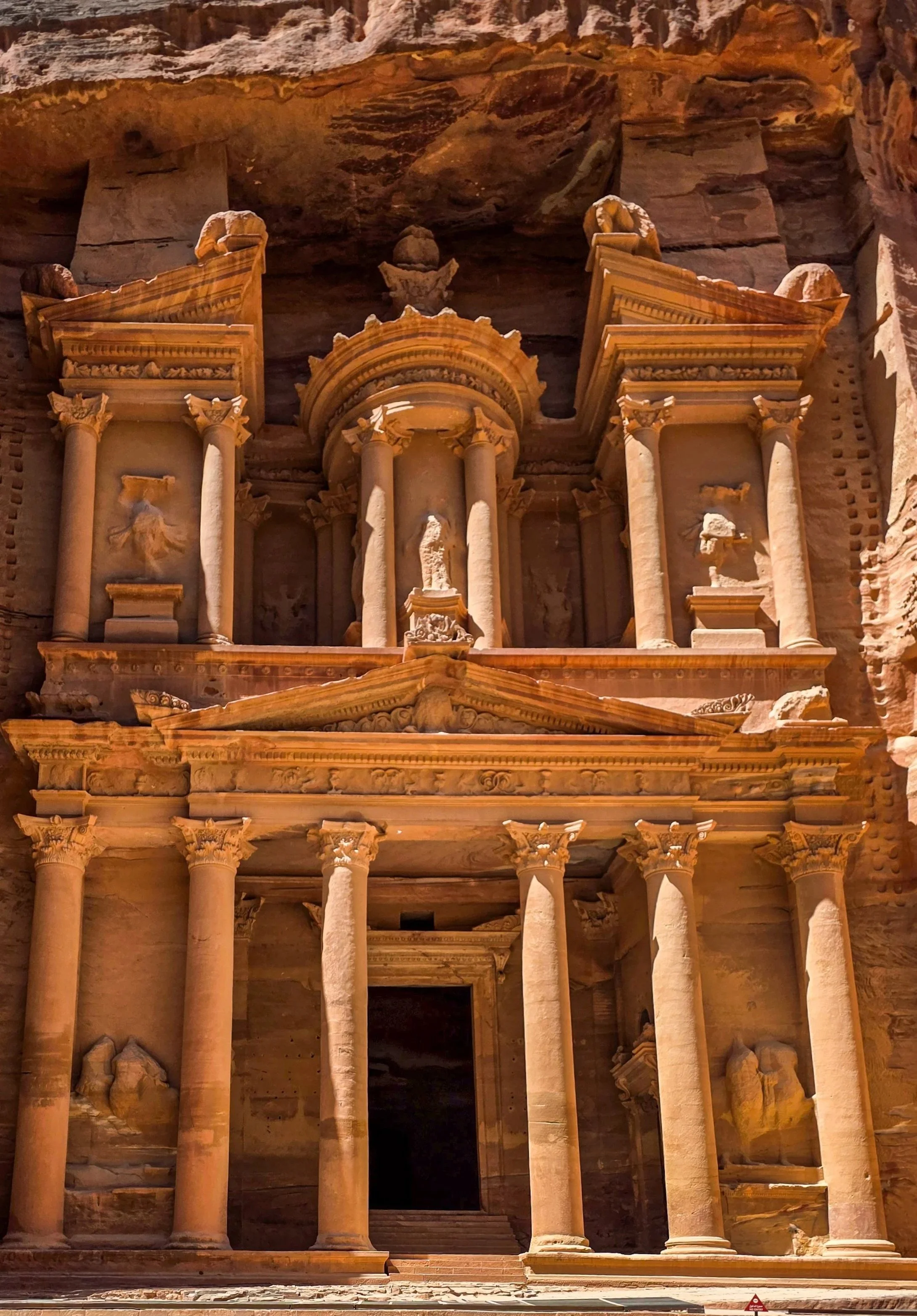 The Treasury at Petra, Jordan, carved into rose-colored sandstone.
