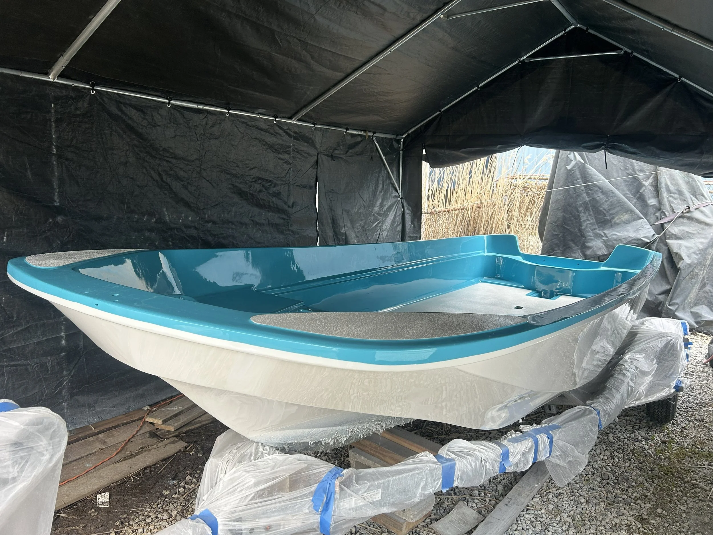 A boston whaler boat restore undergoing major fiberglass repair and also full awlgrip paint job.