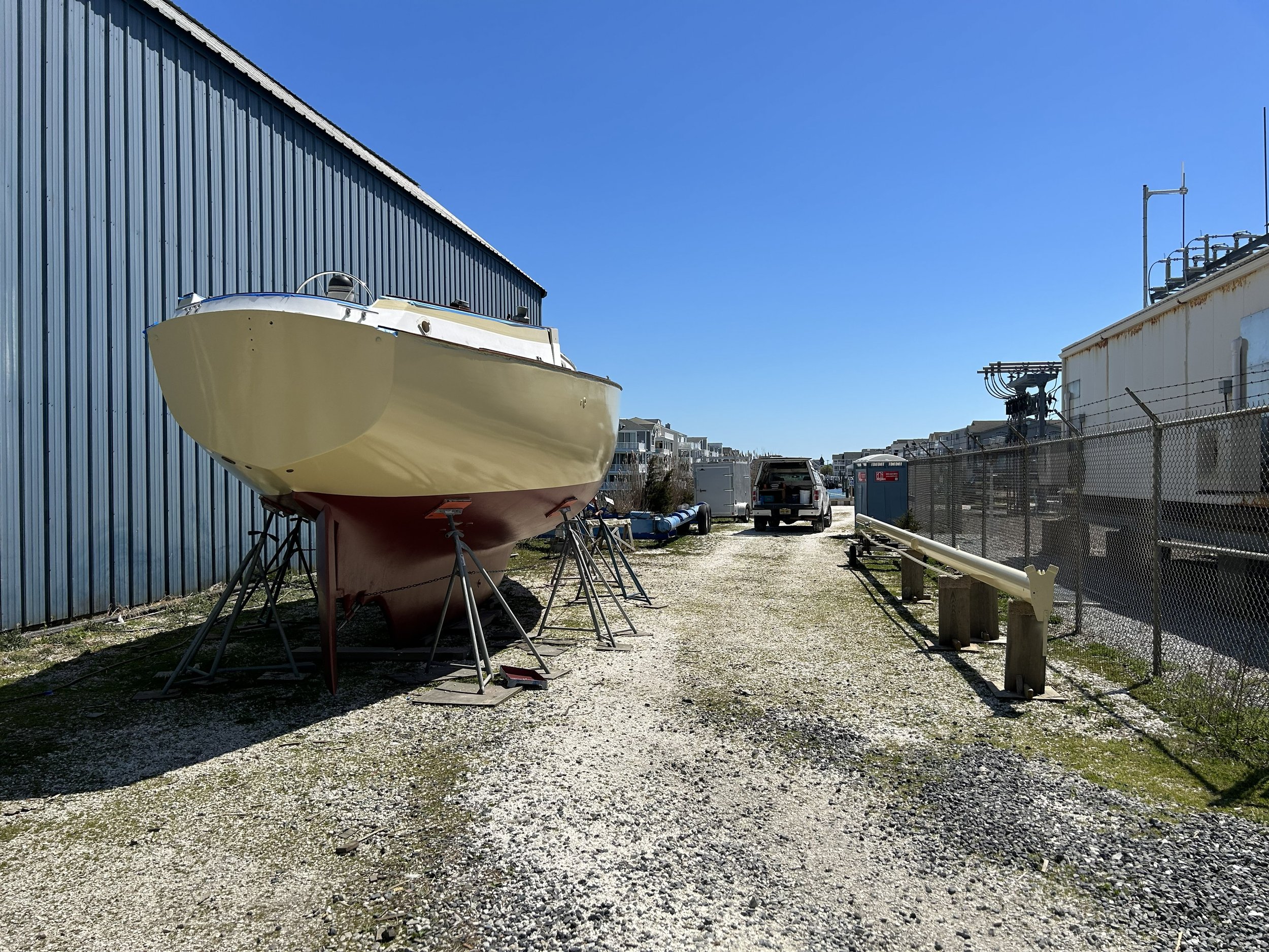 A very large sailboat getting refitted and boat being repainted both hull and bottom. Major marine boat fiberglass repair.
