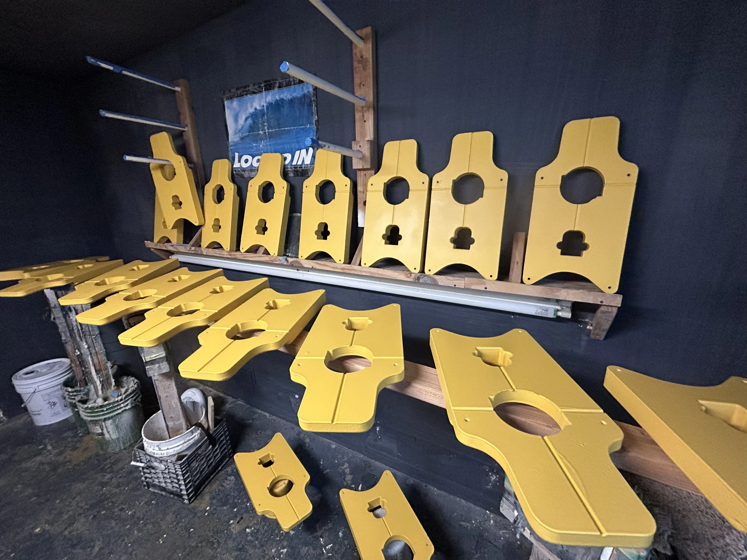 Yellow painted composite marine floats for underwater use.