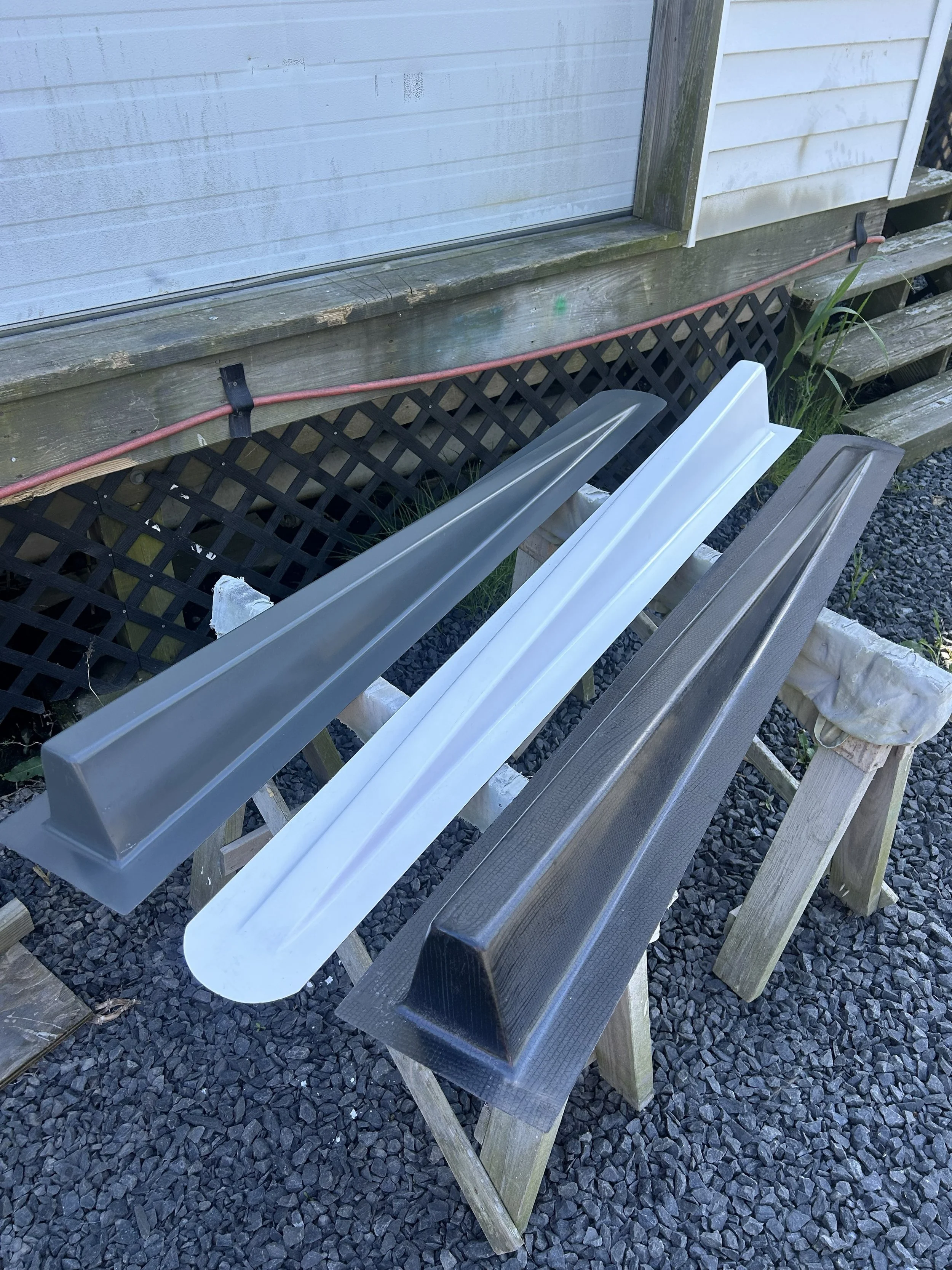 Carbon fiber composite boat equipment that has be manufactured with a vacuum infusion and bagging process.