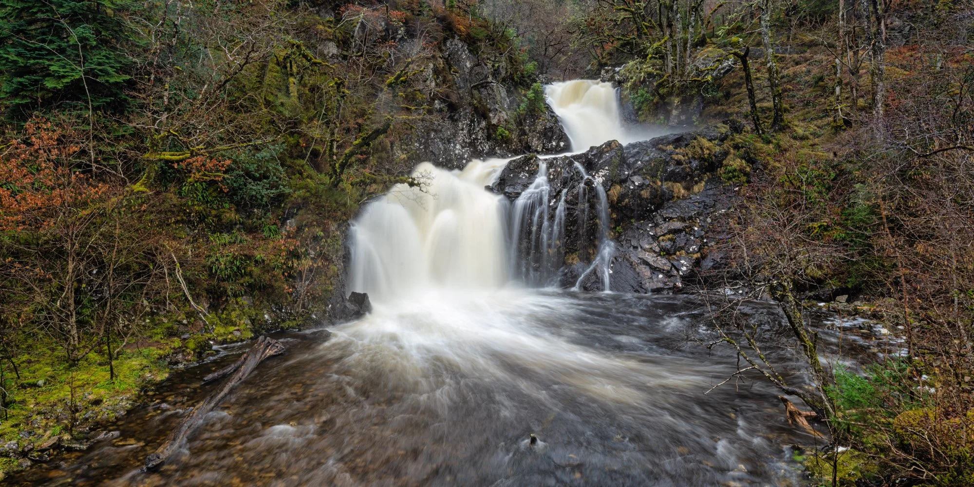 Eas Chia-aig falls near Loch Arkaig in Lochaber, situated just past the end of Loch Arkaig.  The falls are running high as there had been a lot of rain in this late winter scene.
