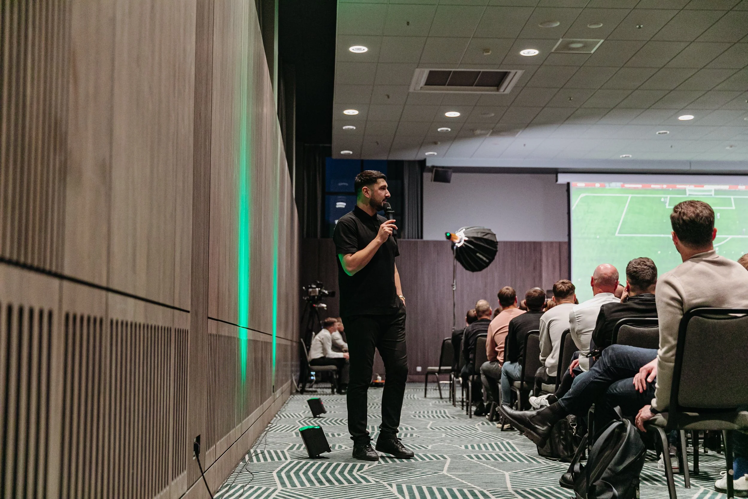 Zurab Amirian presenting during the Football Coaches Conference in Kaunas, Lithuania, sharing insights on coach and player development with an international audience of coaches.