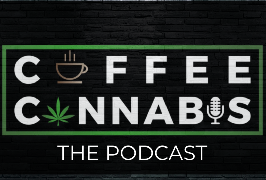 Neon sign with the text 'Coffee & Cannabis: The Podcast' on a black brick wall, featuring icons of a coffee cup, a cannabis leaf, and a microphone.