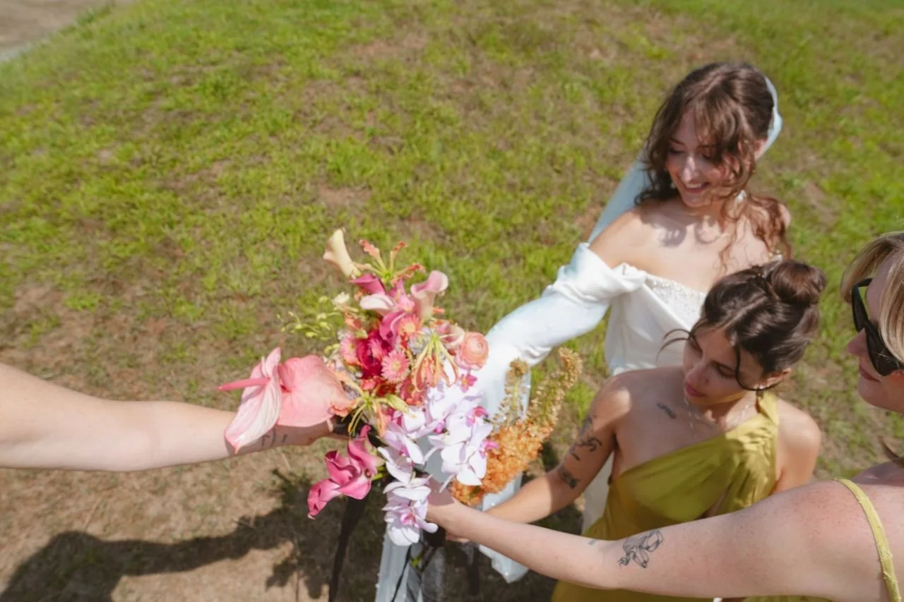 Laurie’s customers, Evan and Kade, running down a mountain after getting married. 