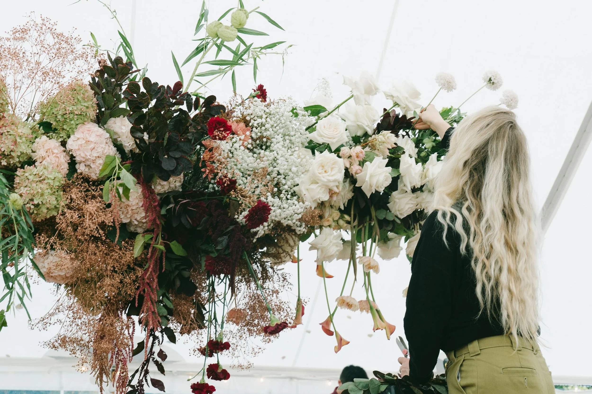 Laurie’s customers, Larissa and Emmett, just married walking off the aisle together.
