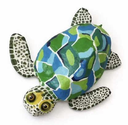 Colourful turtle with a patterned shell and spotted limbs and head.
