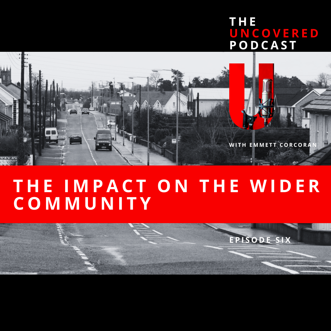 Podcast cover image with a black and white street scene background. Text on top read "The Uncovered Podcast" and "With Emmett Corcoran." A bold red bar across the middle with white text says "The Impact on the Wider Community." A large red u-shaped graphic features a microphone and headphones.