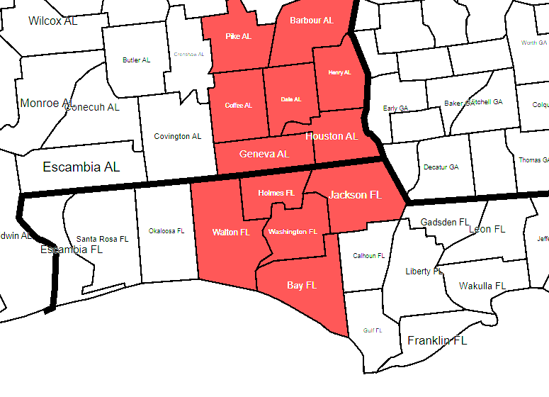 Map of southeastern Alabama and northwestern Florida counties, with Alabama counties in white and Florida counties in red. Key counties labeled include Pike, Barbour, Henry, Dale, Houston, Geneva, Coffee, Holmes, Jackson, Washington, Walton, Bay, and nearby counties.