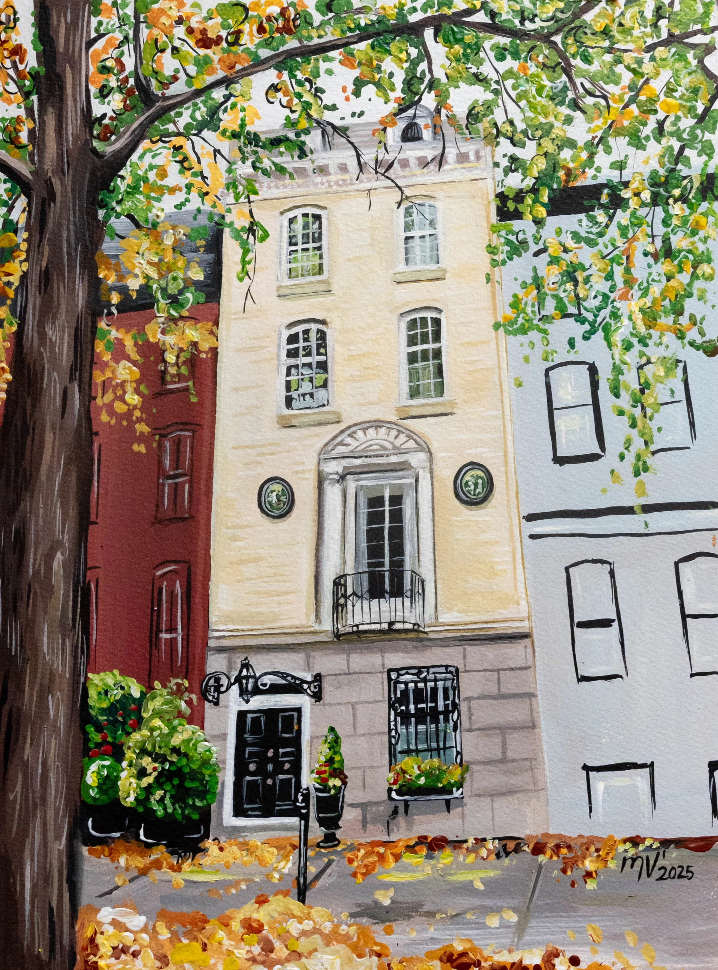 Watercolor painting of a four-story building with a yellow facade and black front door, flanked by a red building on the left and a white building on the right. A large tree with green and yellow leaves partially covers the scene, with fallen leaves on the ground. The building has a small balcony and decorative elements around the windows.