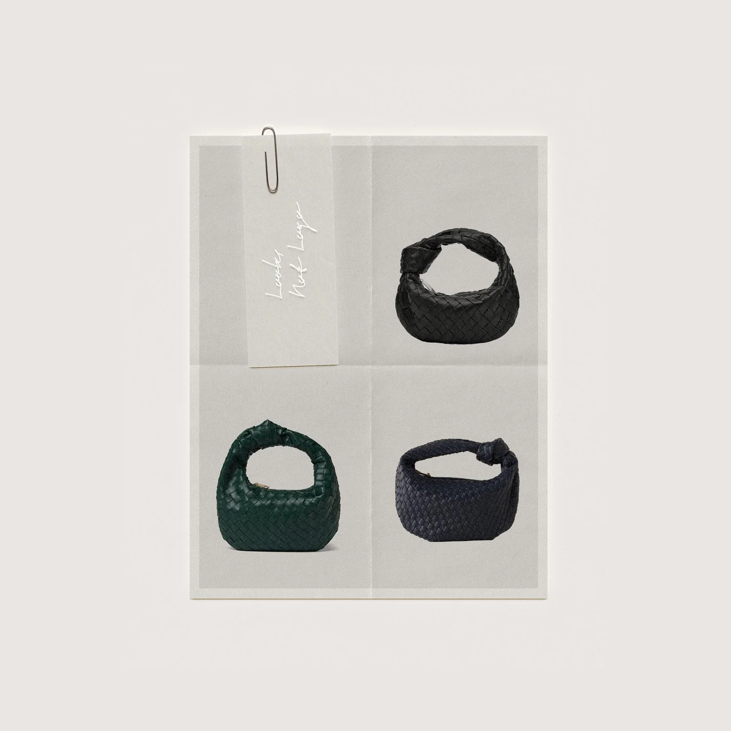 Flat lay of three woven leather handbags in black and dark green, with a white note card attached with a paperclip that reads 'Lovely Not Loot'.