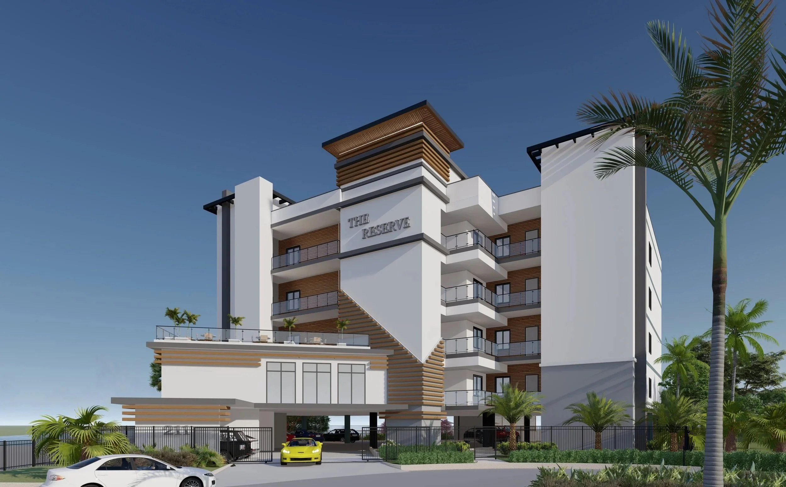 Modern multi-story residential building named "The Reserve" with balconies, landscaping, palm trees, and a parking area with luxury cars.