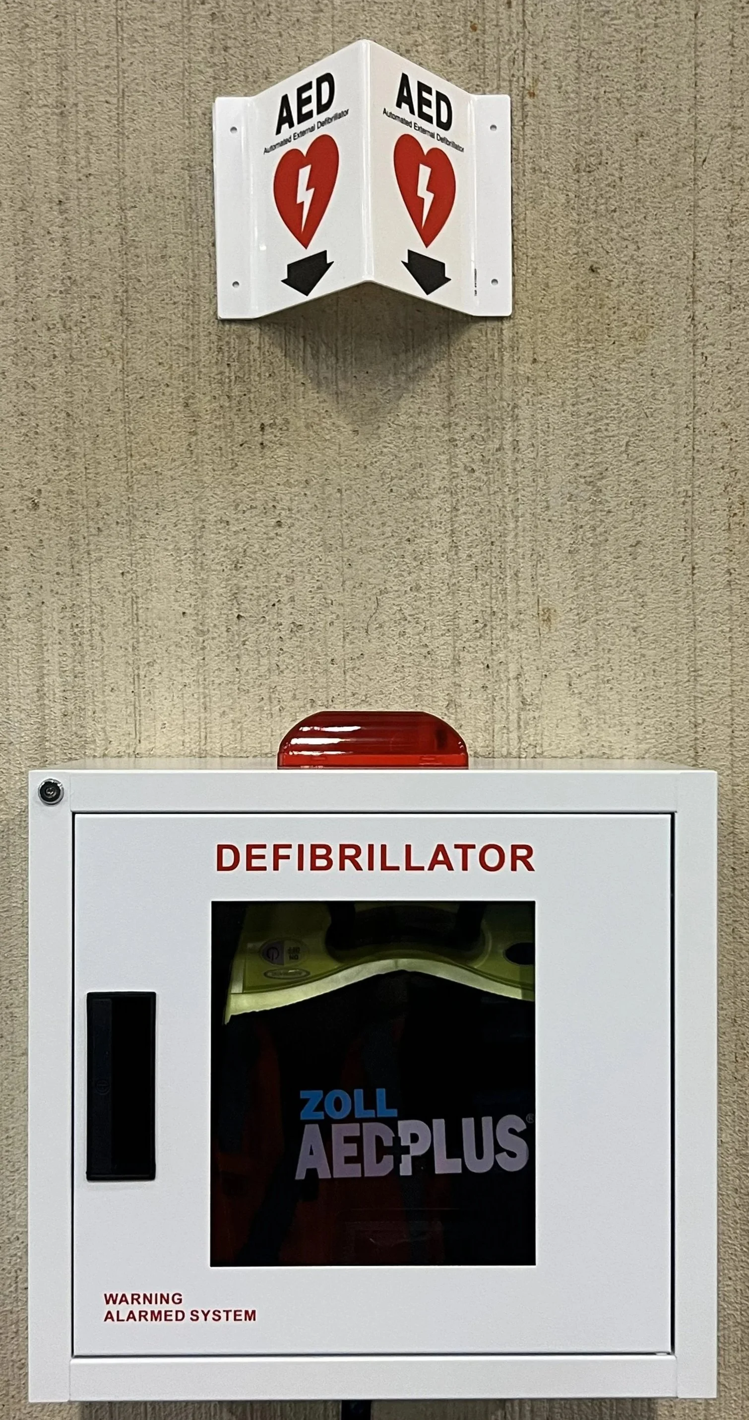 Wall-mounted AED sign to go above a Zoll AEDPlus or AED Plus to inform workers of the location of the Automated External Defibrilator.