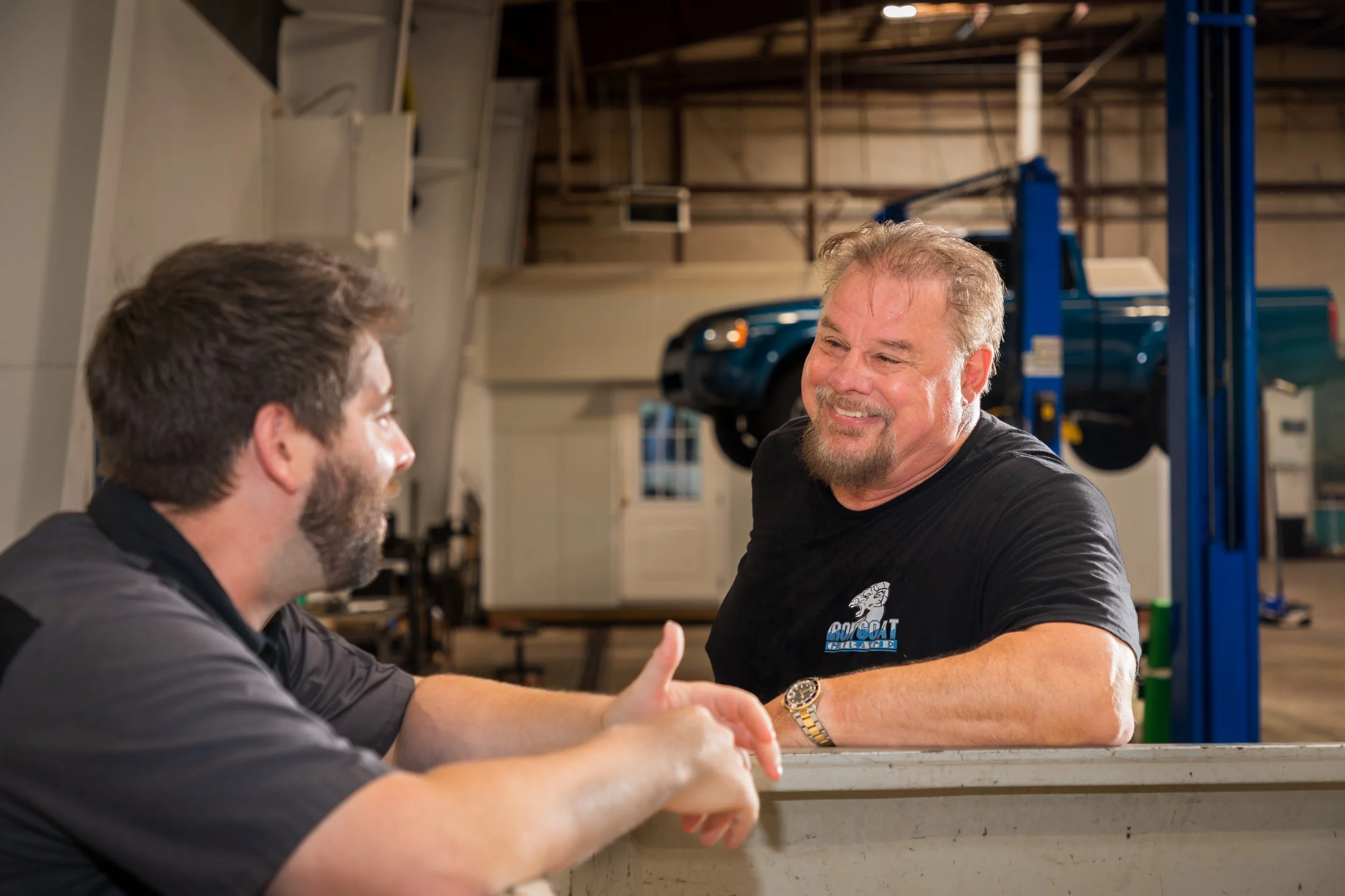 John Bachman having a friendly conversation in Iron Goat Garage.