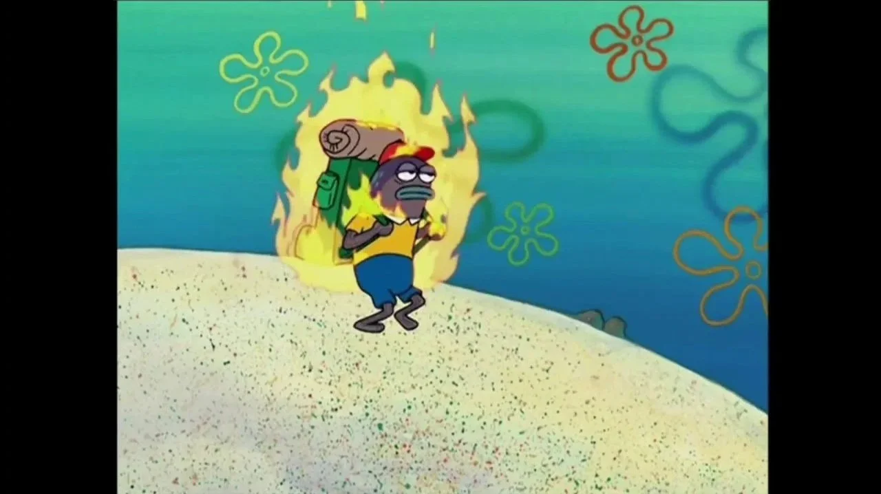 SpongeBob SquarePants character walking out of a fiery explosion on the ocean floor, carrying a rolled-up sleeping bag.
