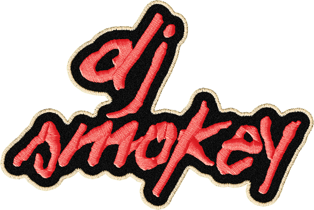 An embroidered patch with the words 'stay spooky' in red cursive letters outlined in beige, on a black background.