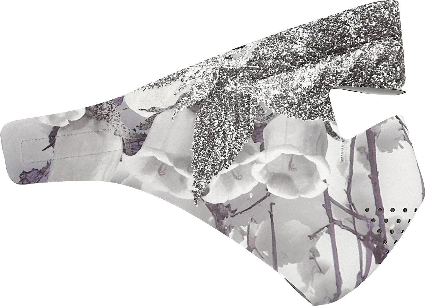 A wrapped gift box with white orchids and silver leaves on top, decorated with a silver glitter star-shaped ornament.