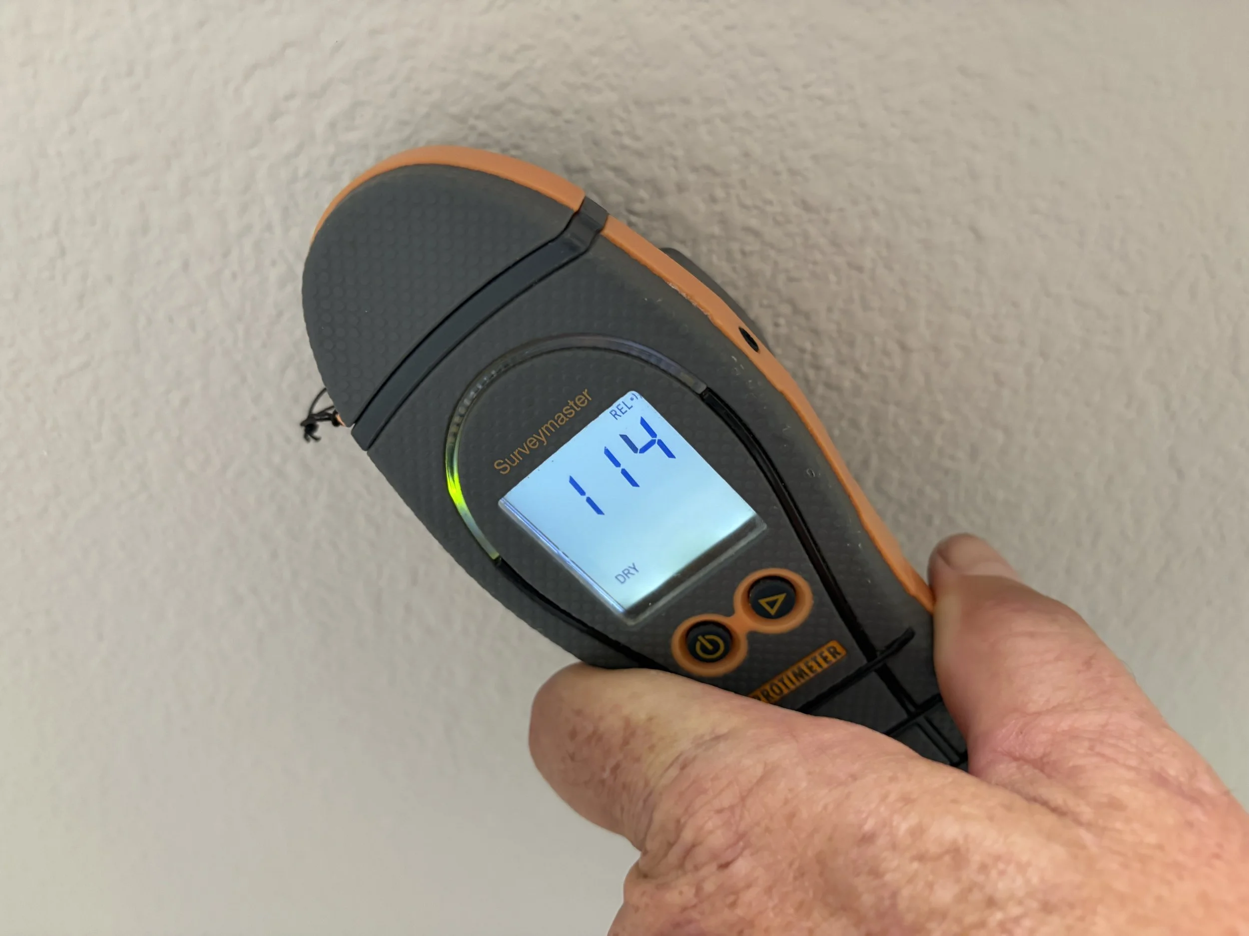Photo of a moisture meter being used during a water damage inspection in Windermere