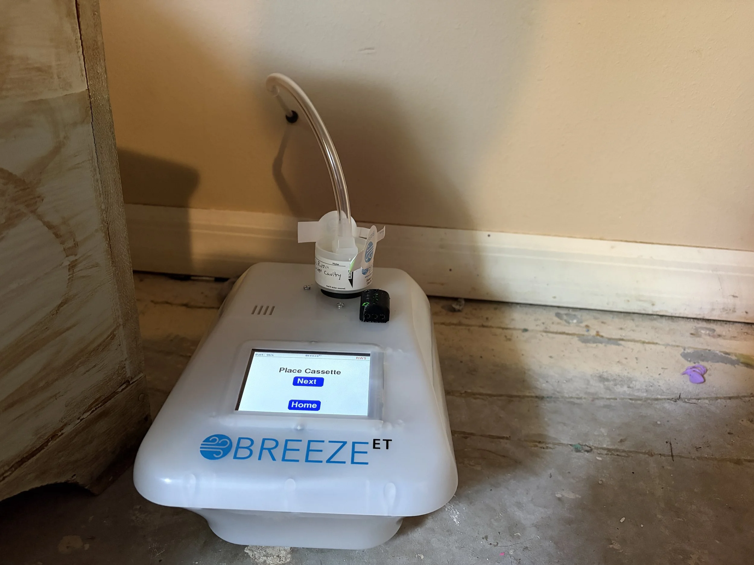 Photo of an air quality test inside a wall cavity in Winter Park
