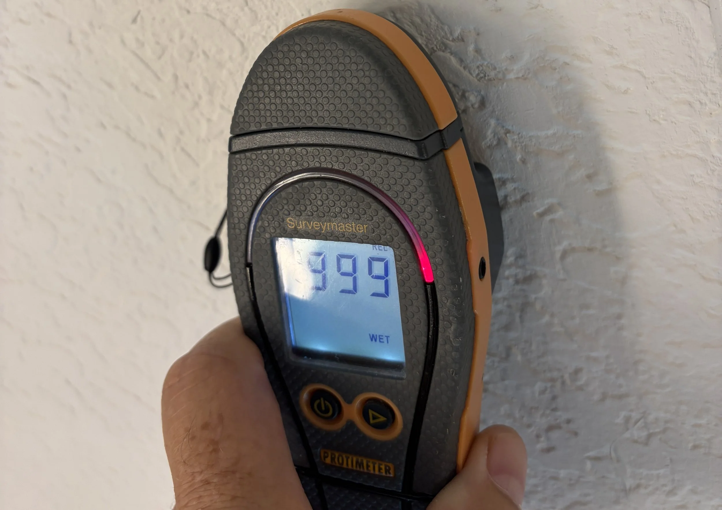 Photo of moisture meter showing elevated moisture during mold inspection in Maitland