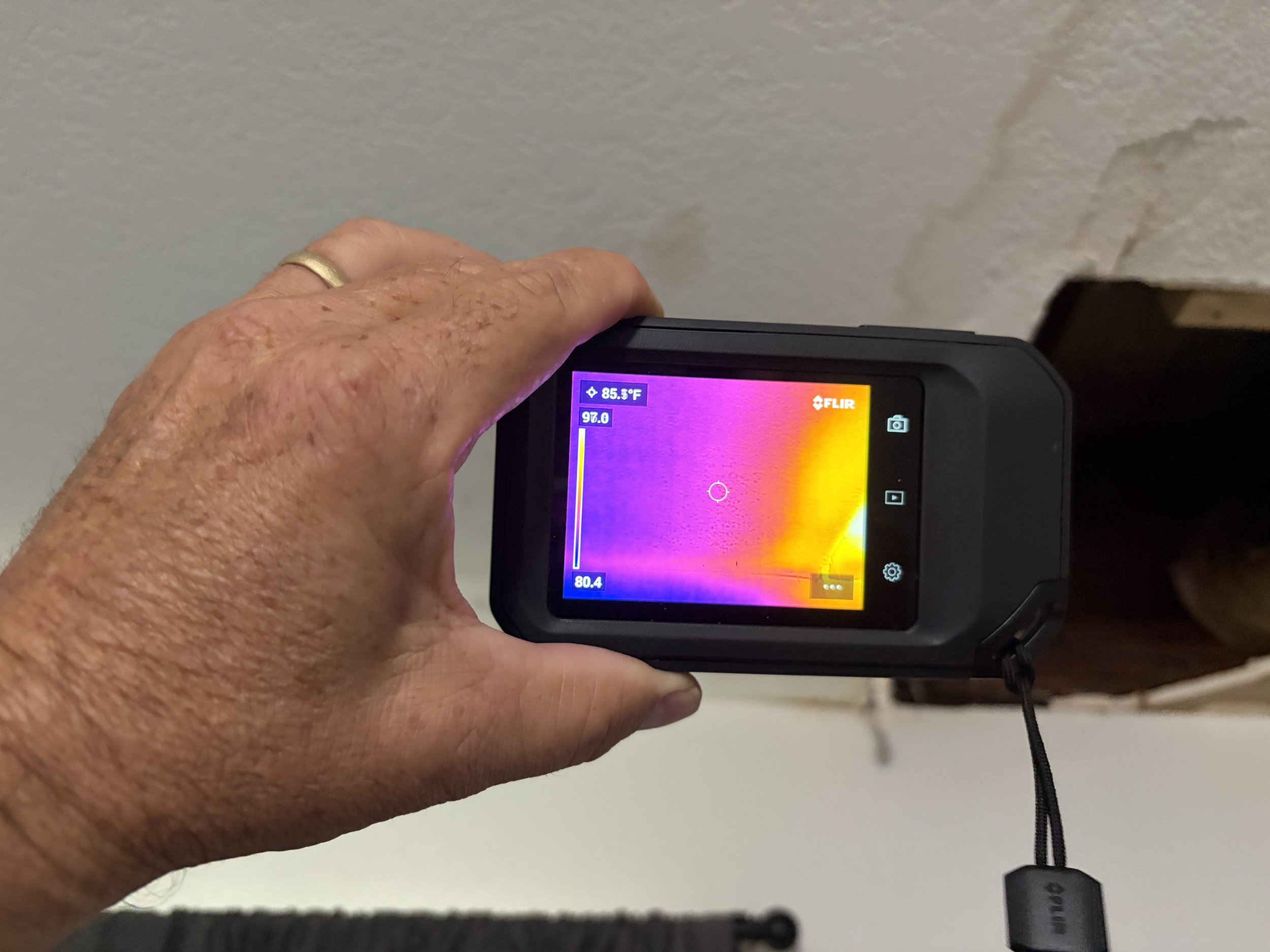 Photo of a thermal imaging camera showing water damage and mold in Orlando