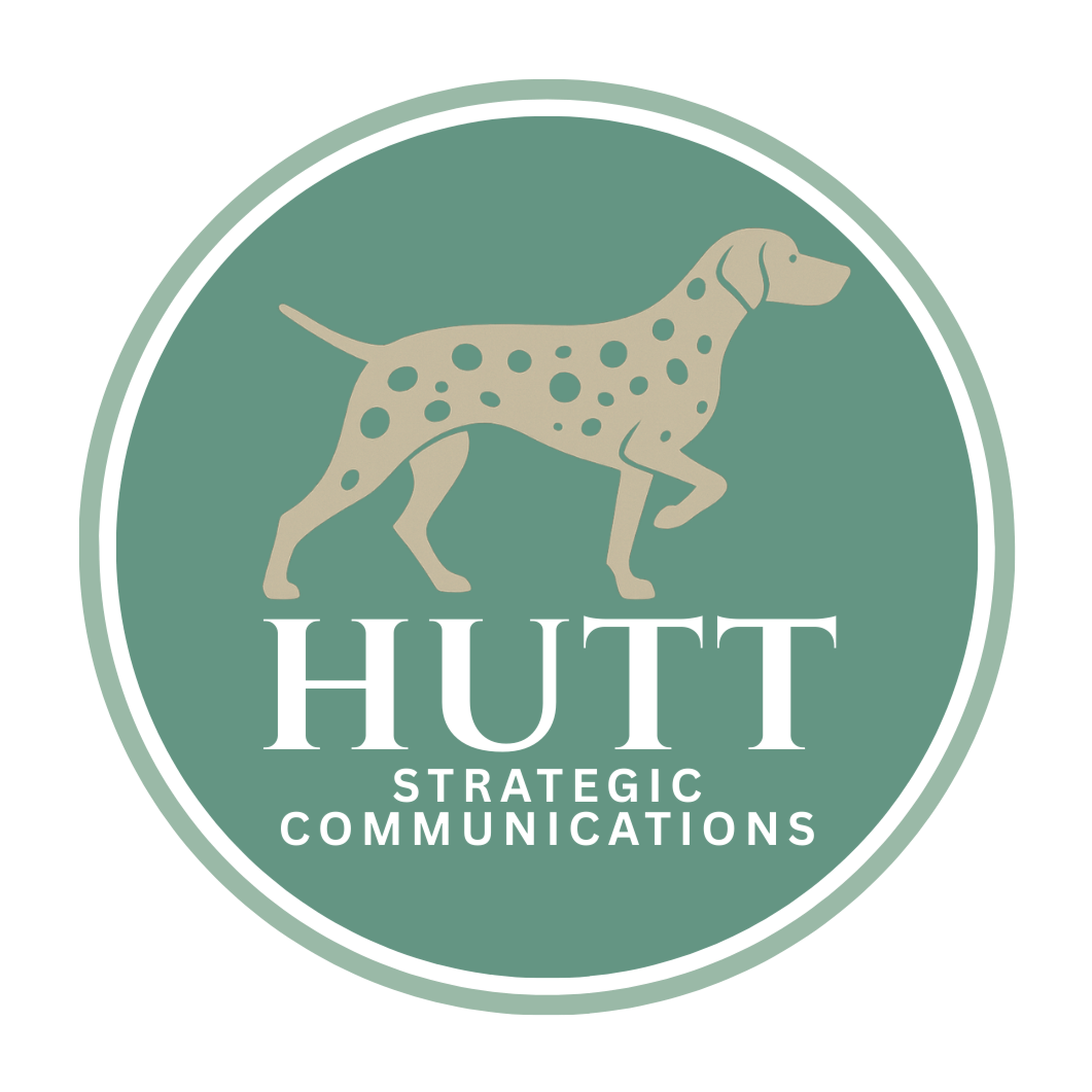 Logo featuring a dog with spots and the text 'HUTT STRATEGIC COMMUNICATIONS'.