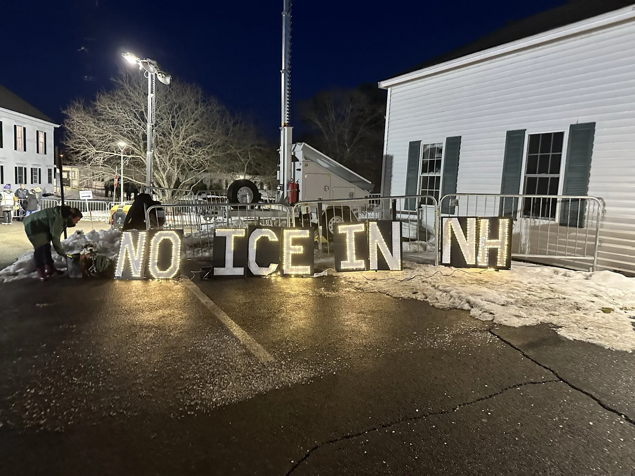 A photograph of a lighted sign that says "No ice in NH." The photo is from a protest that took place Jan 8, 2026.
