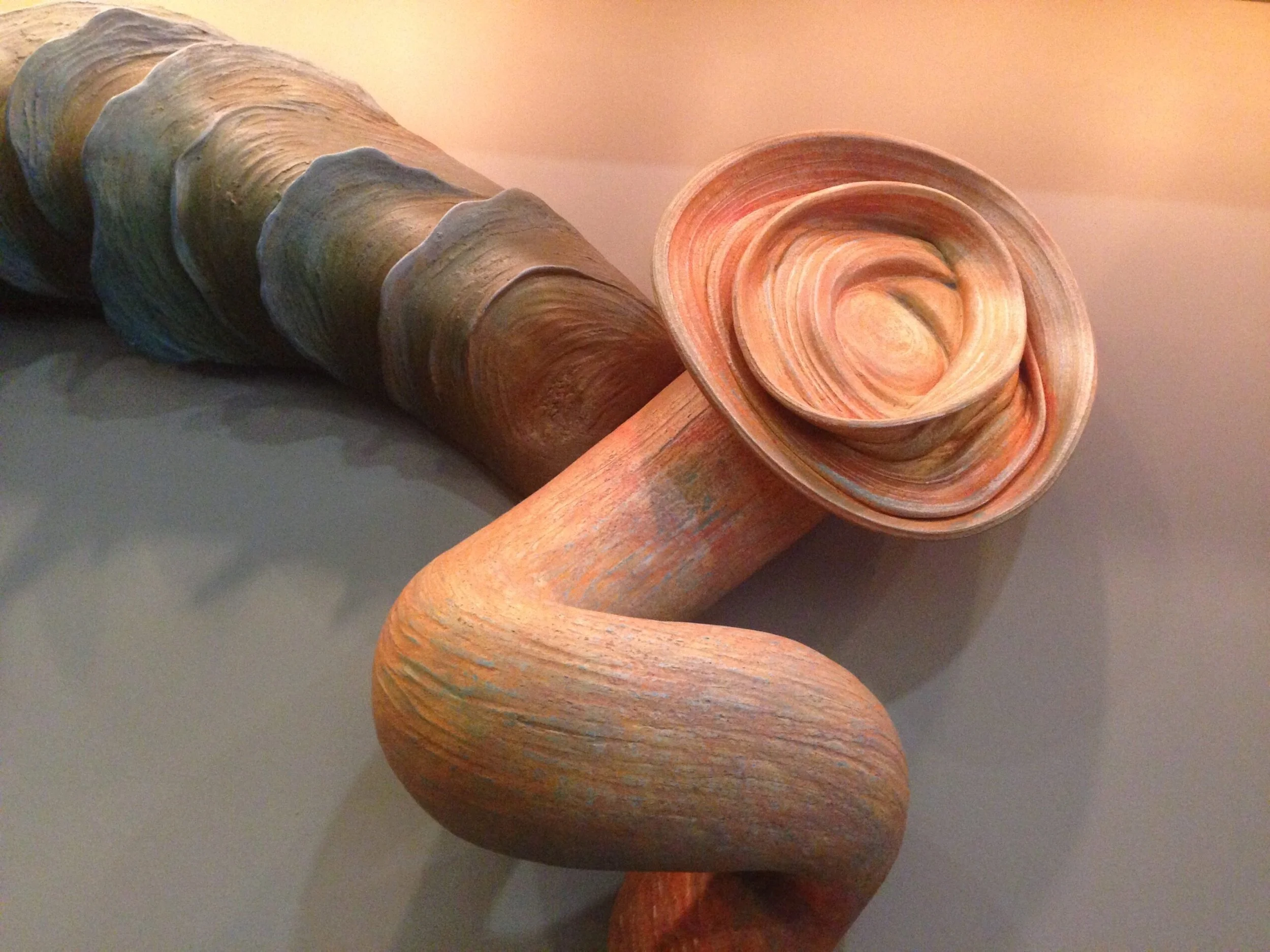  Internal Workings (installation view - detail)  72 x 180 x 8 inches, 1995 Clay and acrylic wash