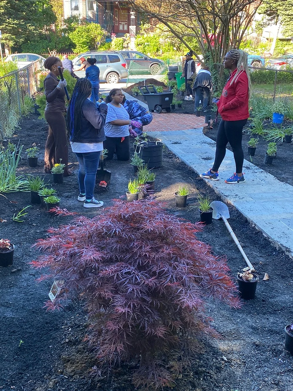 Colored-Girls-writing-group-planting-the-garden.jpg