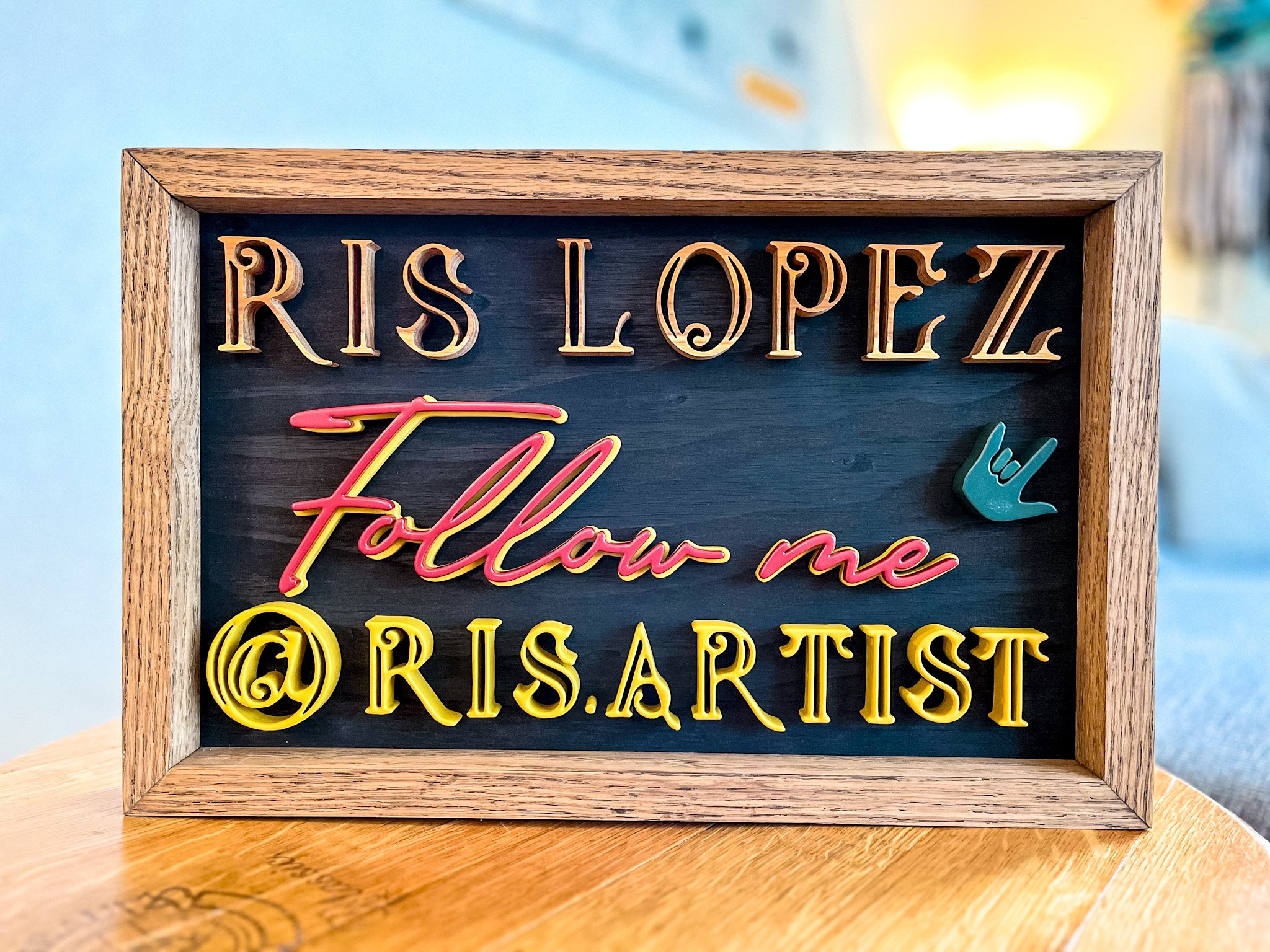 A decorative wooden name sign.