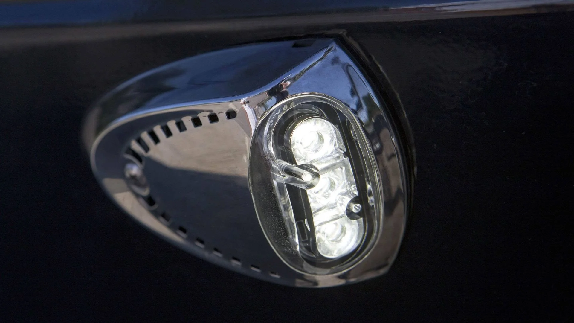 Close-up of a car's daytime running light assembly with LED bulbs.