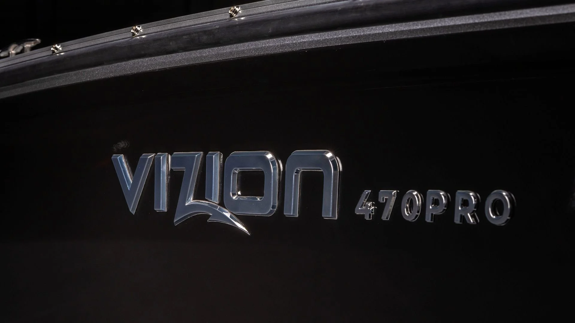 Close-up of a black vehicle with a chrome "Vizon" badge and "470 PRO" markings.