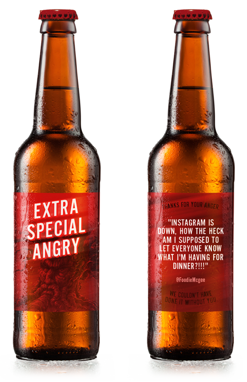 Two brown glass beer bottles with red caps, condensation on the surface, with humorous labels, placed side by side.