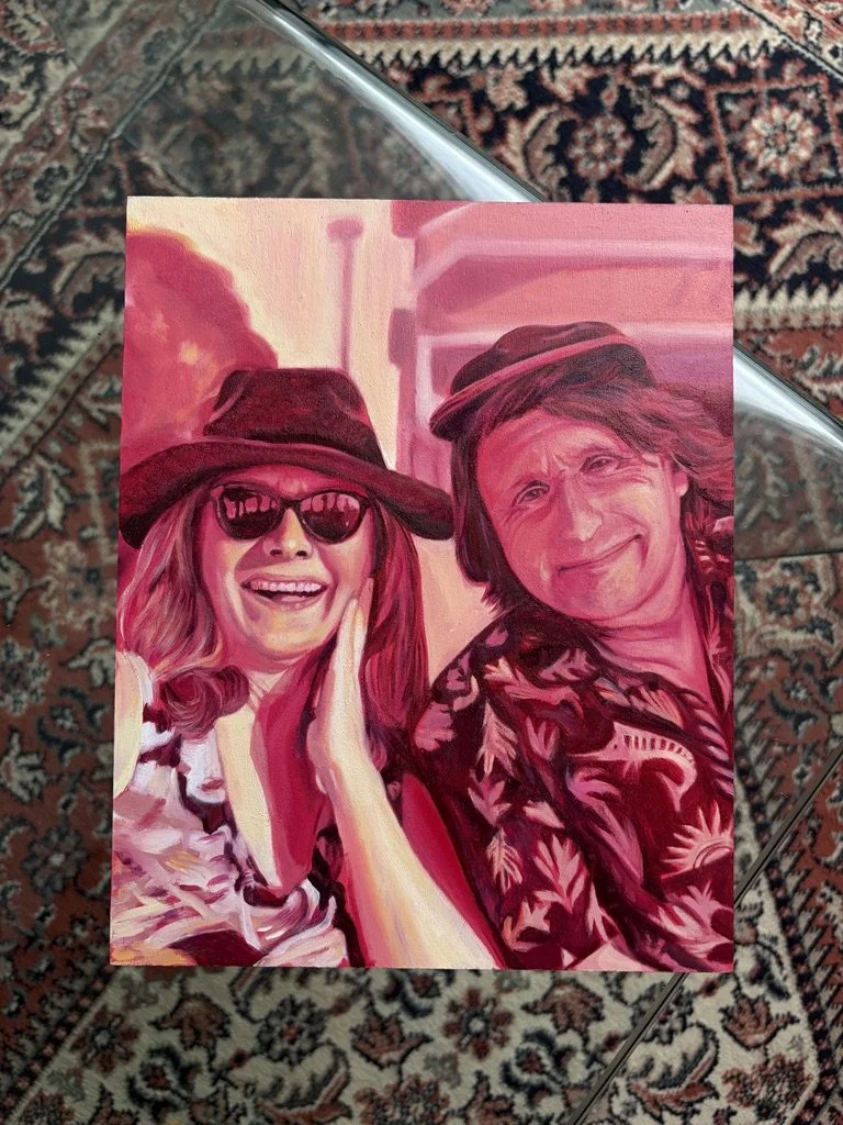 A colorful painting of a smiling woman wearing sunglasses and a hat, and a man in a patterned shirt and hat, both with long hair, standing close together.