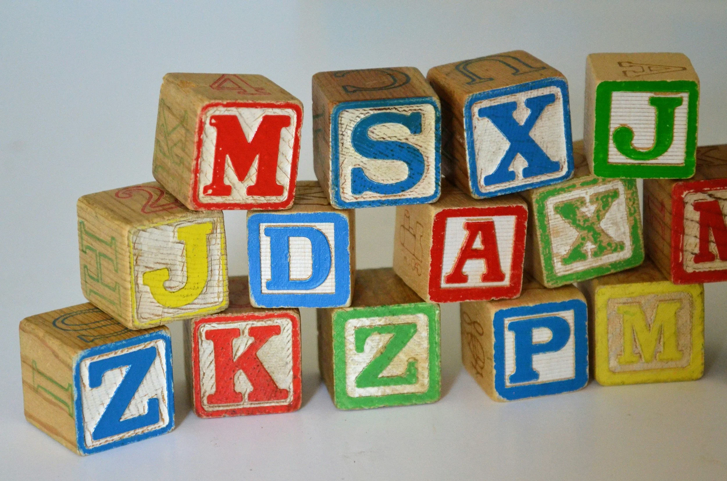 Colorful wooden blocks with letters of the alphabet